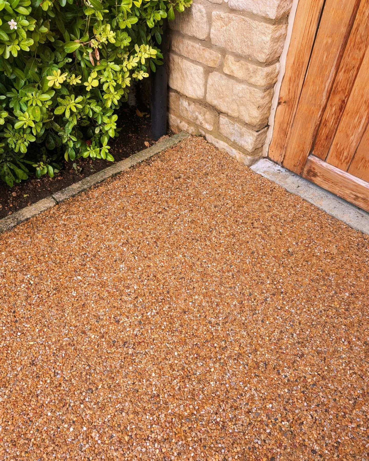The same exposed aggregate driveway after professional cleaning